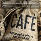 Close-up of hand-screenprinted personalized burlap favor bags